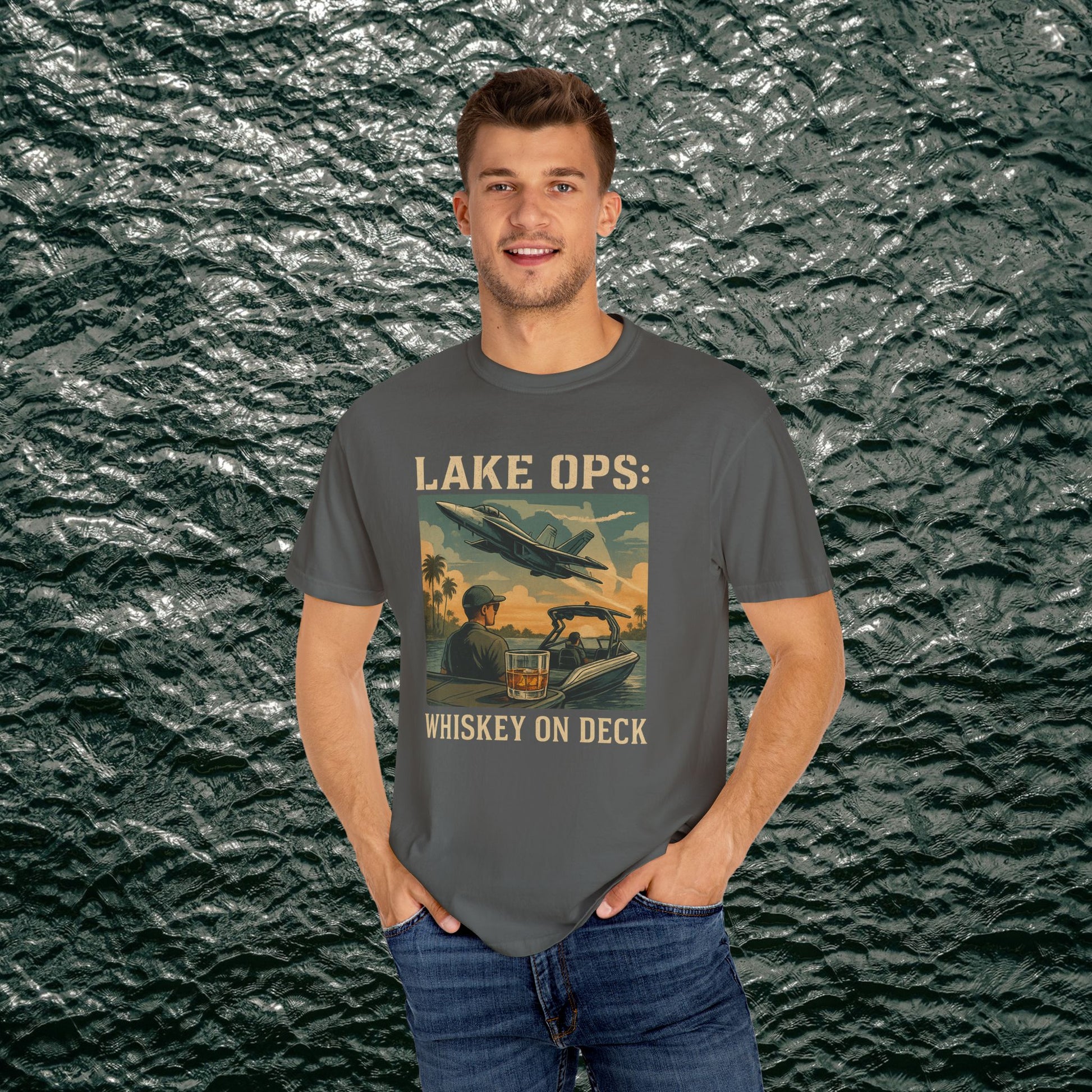 Garment-Dyed Comfort Tee For Adults showcasing 'LAKE OPS: WHISKEY ON DECK' with a scenic design, modeled by a man, available in sizes S-4XL.