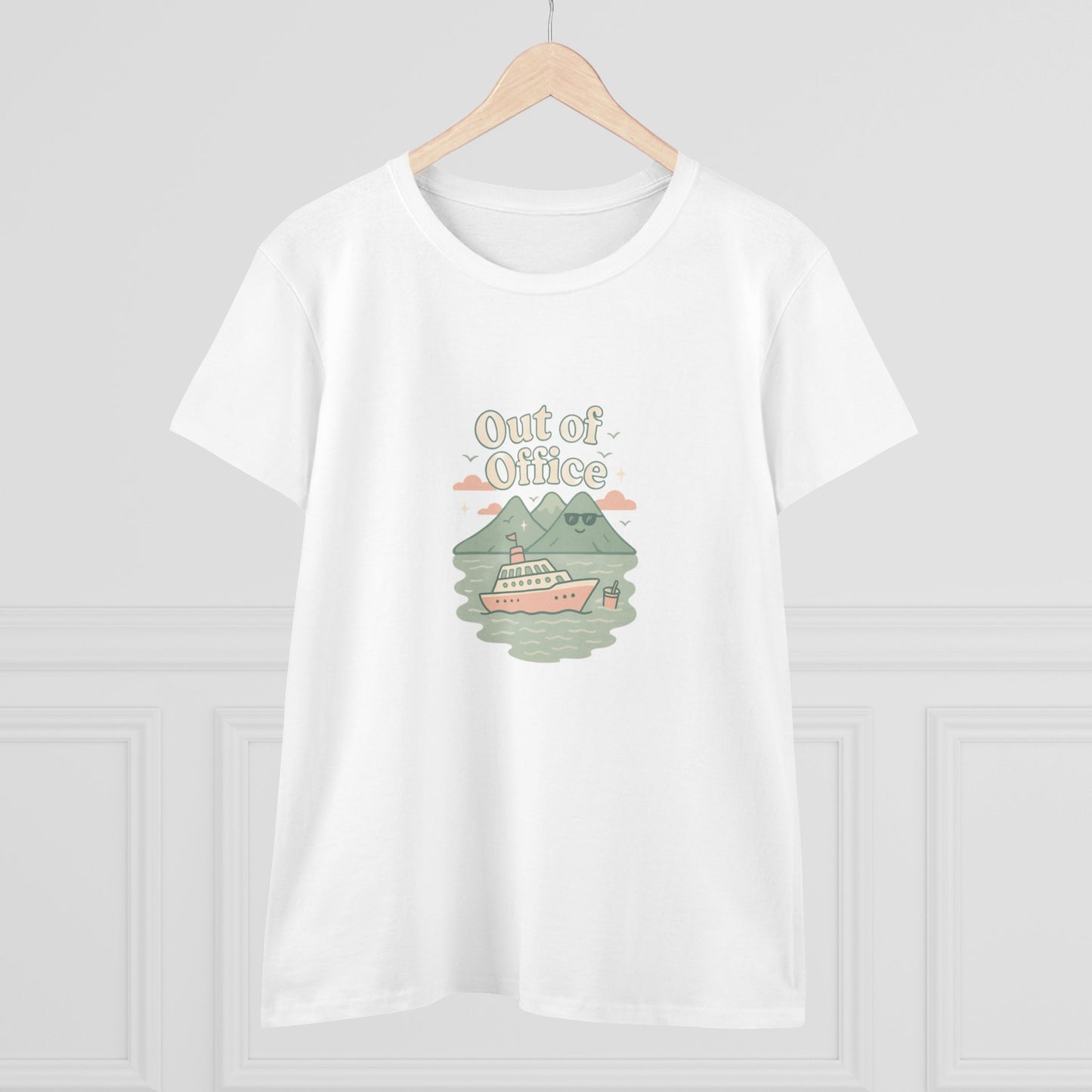 Display of the Out Of Office Cruise Tee on a hanger, featuring its unique boat graphic and mountain backdrop, perfect for warm weather outings.