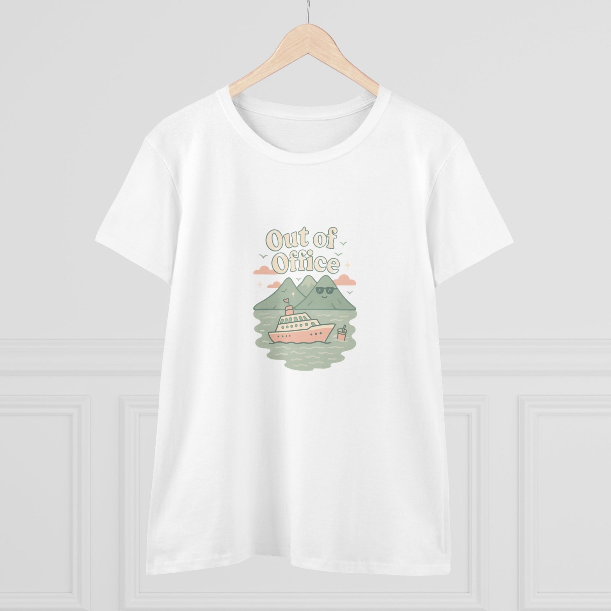 Display of the Out Of Office Cruise Tee on a hanger, featuring its unique boat graphic and mountain backdrop, perfect for warm weather outings.