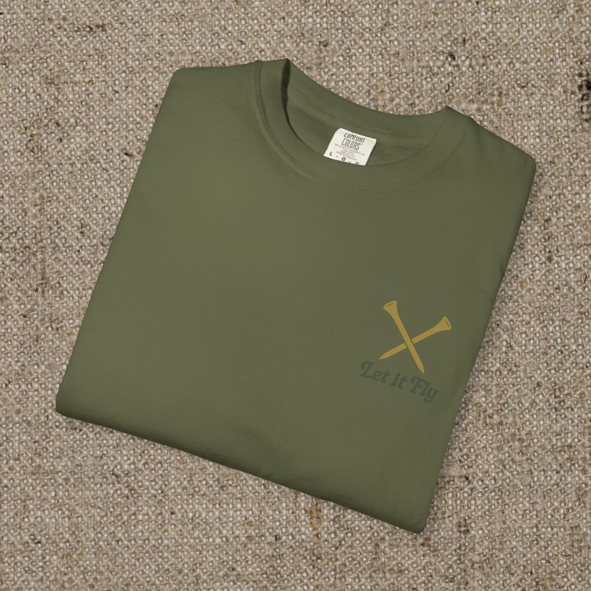 Folded Tee It High Let It Fly Graphic Tee in olive green with stylish golden crossed golf clubs, ideal for casual wear.