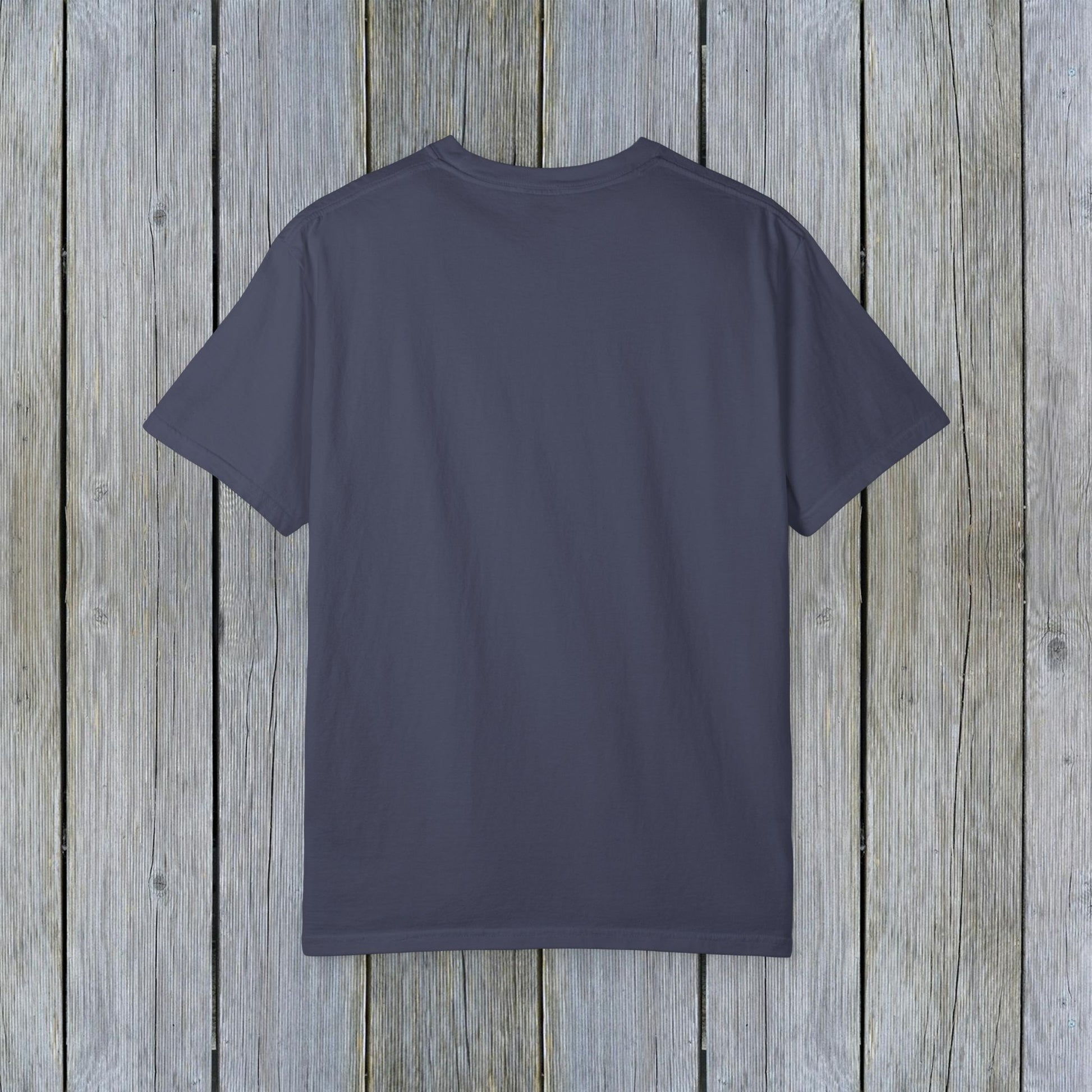 Back view of the Unisex Garment-Dyed Lake Rules Tee - Soft Vintage Fabric, Sizes S to 4XL, ideal for outdoor adventures, displayed against a weathered wooden texture.