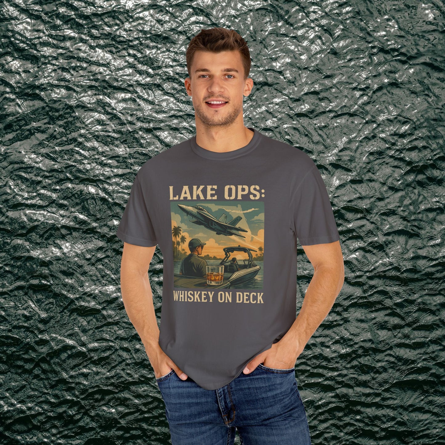 Garment-Dyed Comfort Tee For Adults highlighting 'LAKE OPS: WHISKEY ON DECK' with a vibrant graphic, worn by a man, available in sizes S-4XL.