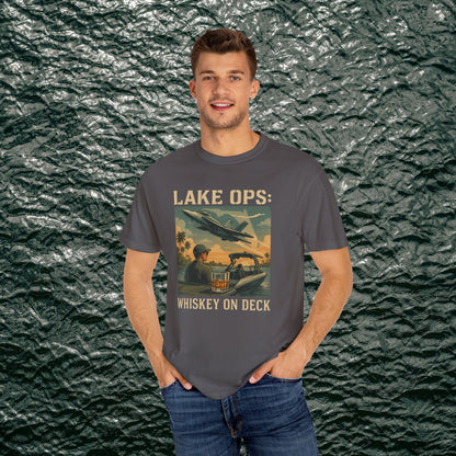 Garment-Dyed Comfort Tee For Adults highlighting 'LAKE OPS: WHISKEY ON DECK' with a vibrant graphic, worn by a man, available in sizes S-4XL.