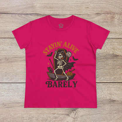 Vibrant pink Stayin’ Alive T-Shirt showcasing a playful skeleton illustration, ideal for fun Halloween celebrations.
