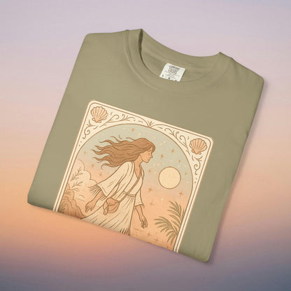 Wanderer Tarot Graphic Tee in earthy olive green, featuring an enchanting illustration of a woman in a serene landscape, ethically produced with 100% cotton and offered in sizes S to 4XL.