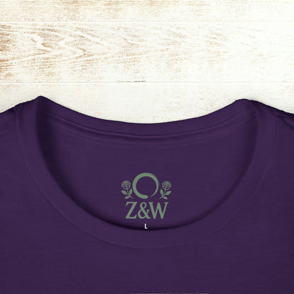 Detailed view of the collar on the No Bad Vibes Tee with Z&W logo in a vibrant purple shade, made from sustainable cotton.