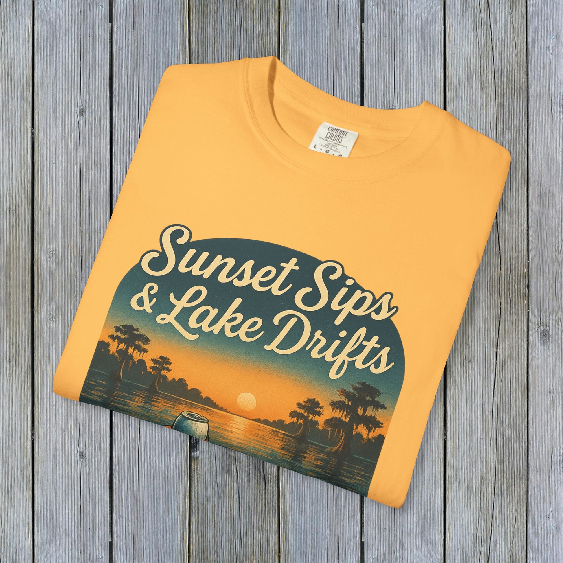 Lake Drifts T-Shirt in vibrant yellow featuring 'Sunset Sips & Lake Drifts' graphic, a great addition to summer attire.