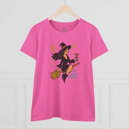 Front view of the Witchy Night Out Tee, highlighting the charming witch illustration with cocktail, set against a bright pink background.