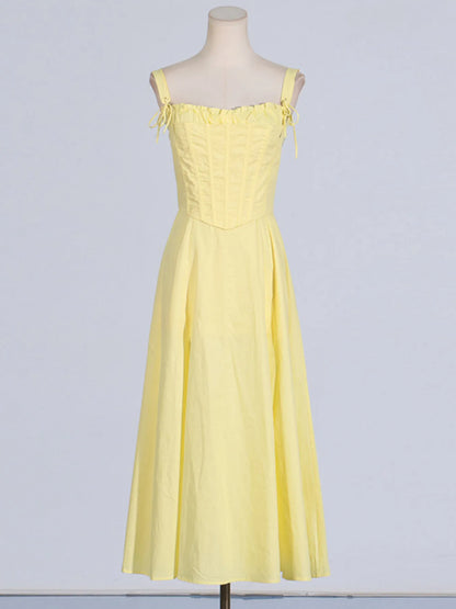 Front display of the Trendy Slit Sleeveless Midi Dress with Zip Back in yellow on a mannequin, emphasizing its frill detail and sophisticated silhouette.