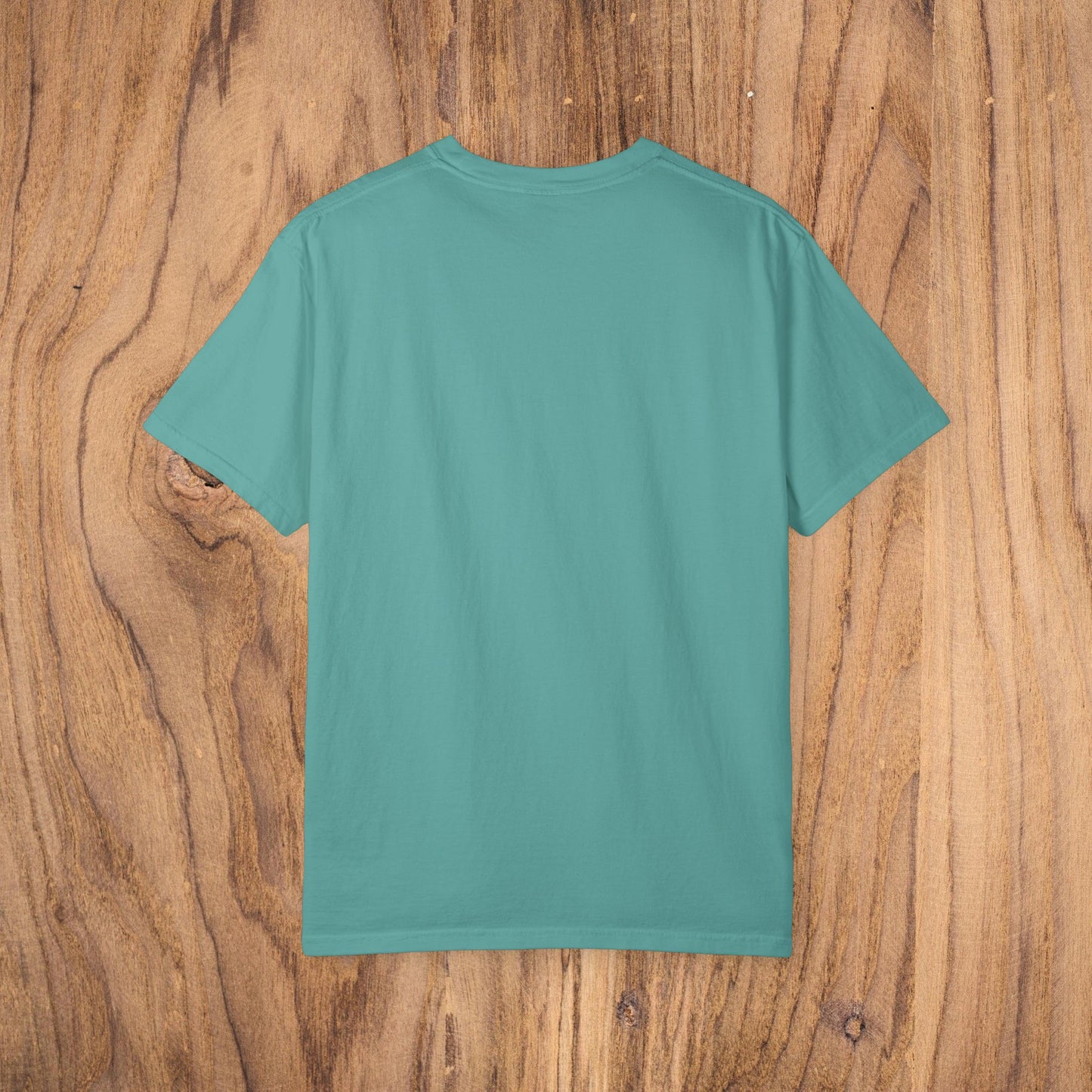 Unisex Sunset Palm Tree T-Shirt - Back view of a vibrant teal garment-dyed cotton tee designed for both men and women.