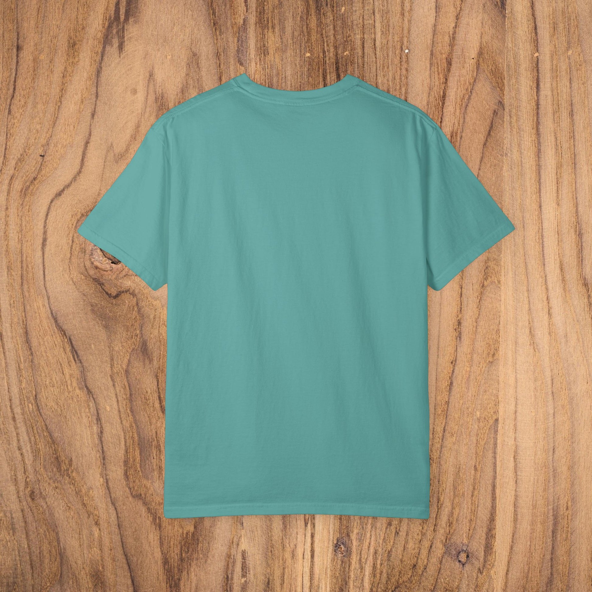 Unisex Sunset Palm Tree T-Shirt - Back view of a vibrant teal garment-dyed cotton tee designed for both men and women.