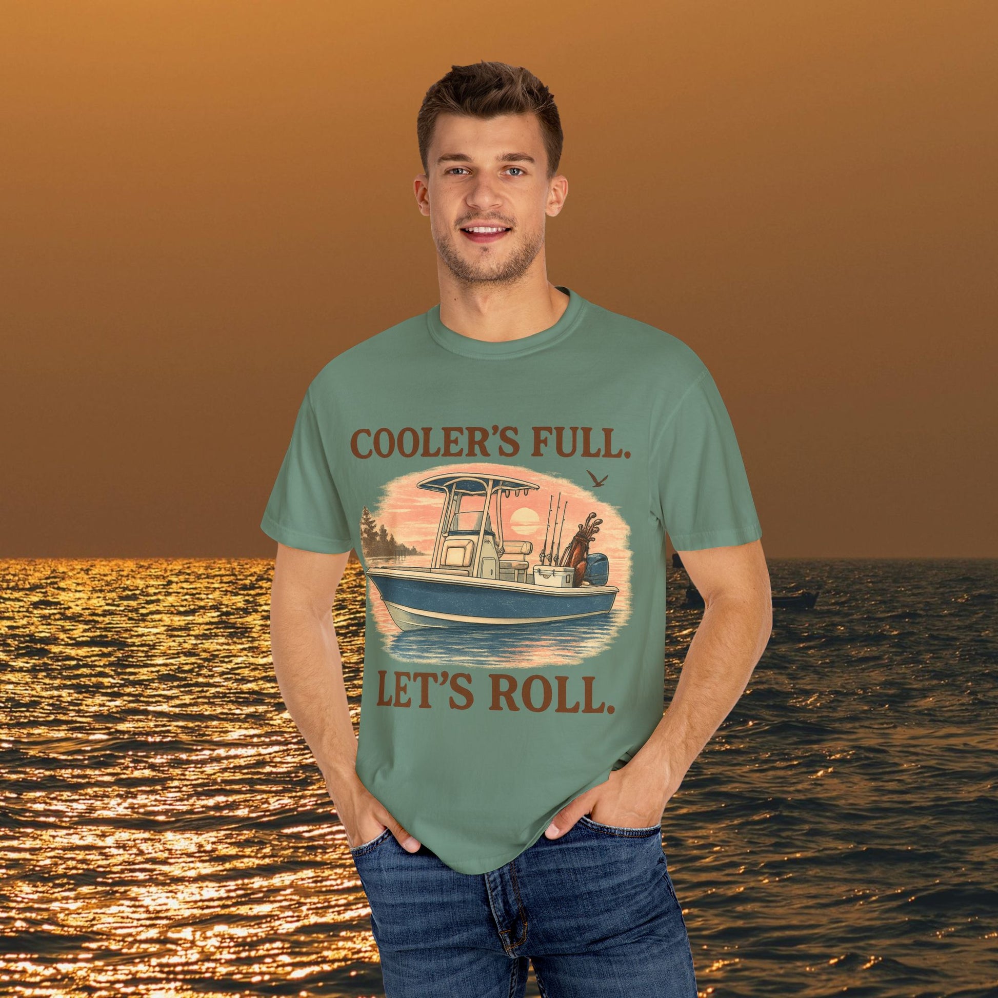 Model wearing the Men's & Women's Durable Cotton Full Tee in teal with fishing graphics, ideal for casual outings by the water.
