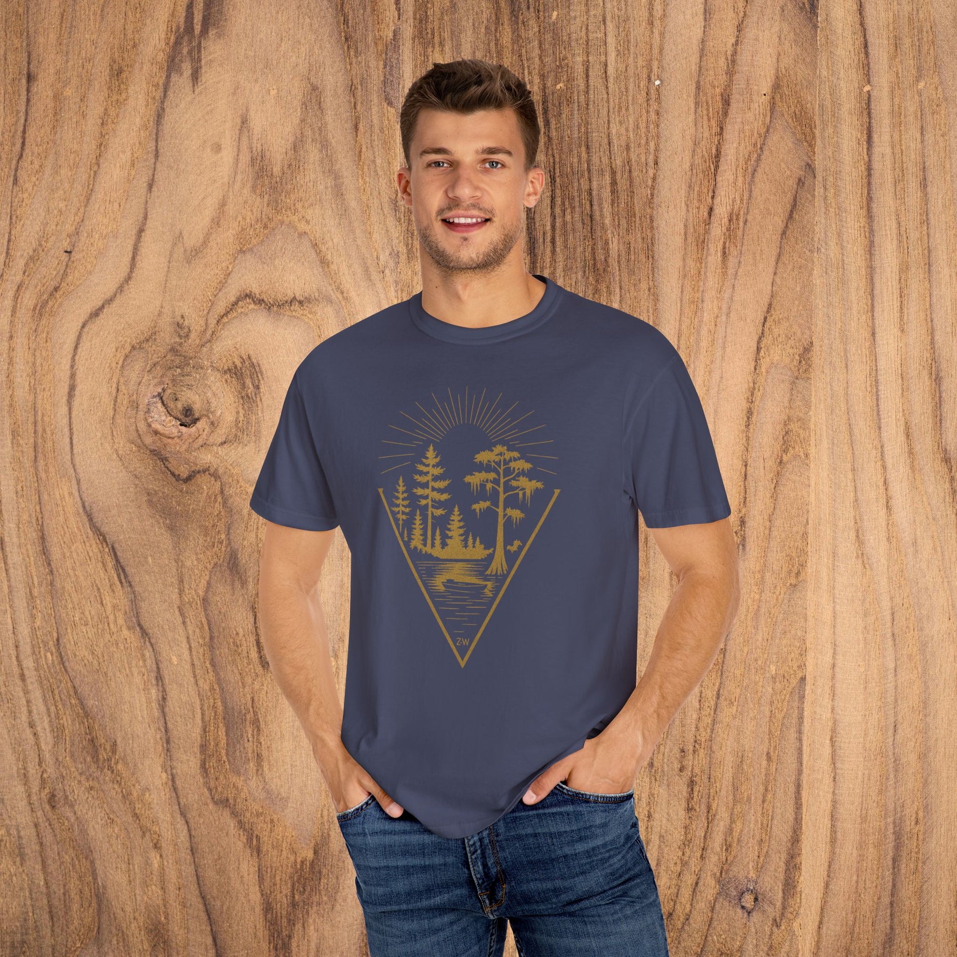 Nature Outdoor Vibes Tee - Soft 100% US Cotton, model wearing a navy T-shirt with a forest graphic, ideal for casual outings and outdoor adventures.