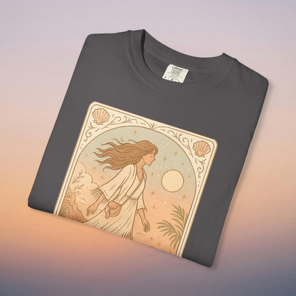 Wanderer Tarot Graphic Tee in charcoal gray, featuring a captivating design of a woman walking under the moonlight. Ethically crafted from 100% cotton, this tee offers a unique style and comfort in sizes S to 4XL.