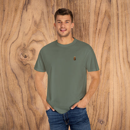 Premium Southern Made T-Shirt in olive green, perfect for stylish casual wear, modeled by a young man against a natural wood background, showcasing versatility and comfort, available in multiple sizes.