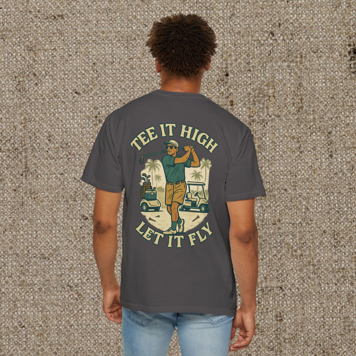 Tee It High Let It Fly Graphic Tee showing a golfer on the back, modeled by a man; your go-to shirt for golfing and casual outings.