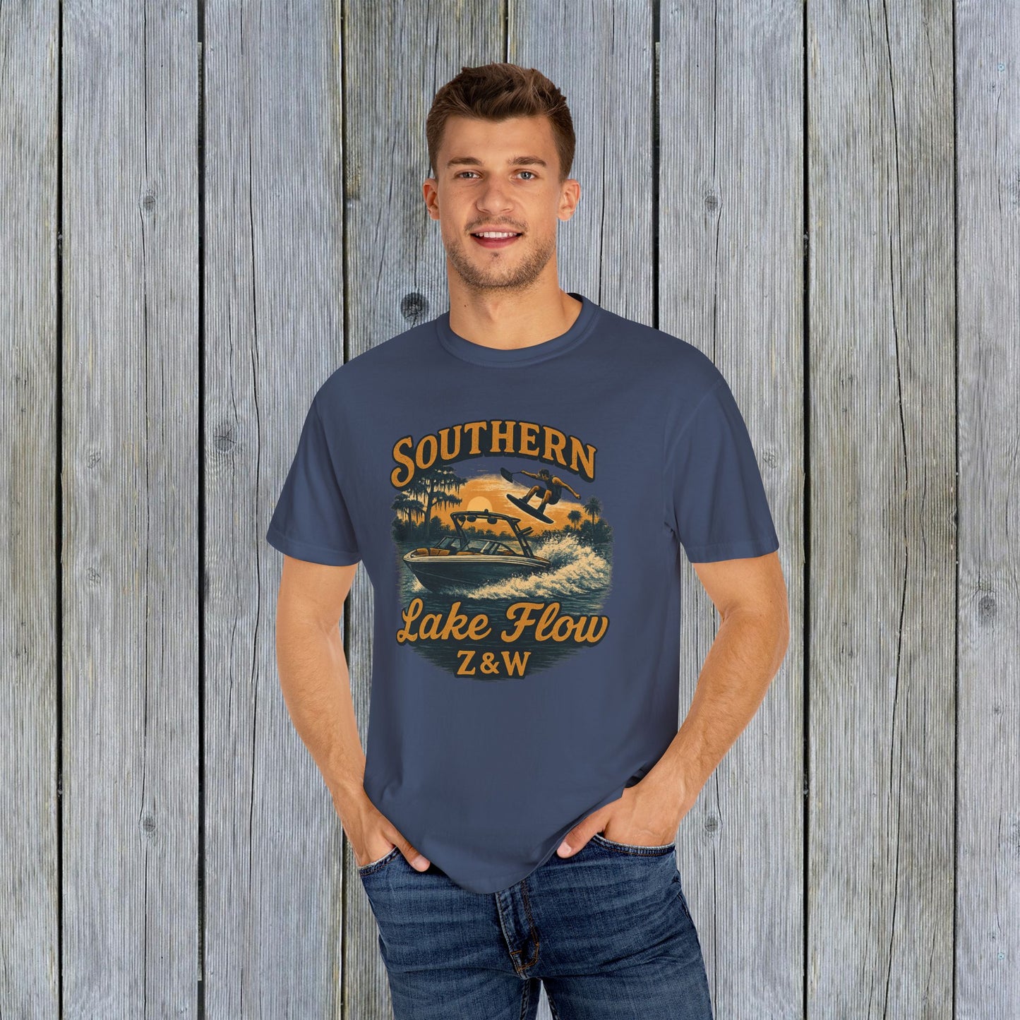 Model wearing the Southern Lake Flow T-Shirt in navy blue, featuring a stylish water sports graphic, ideal for outdoor enthusiasts and made from sustainable materials.