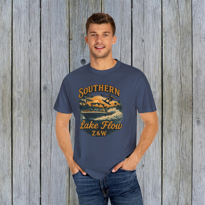 Model wearing the Southern Lake Flow T-Shirt in navy blue, featuring a stylish water sports graphic, ideal for outdoor enthusiasts and made from sustainable materials.