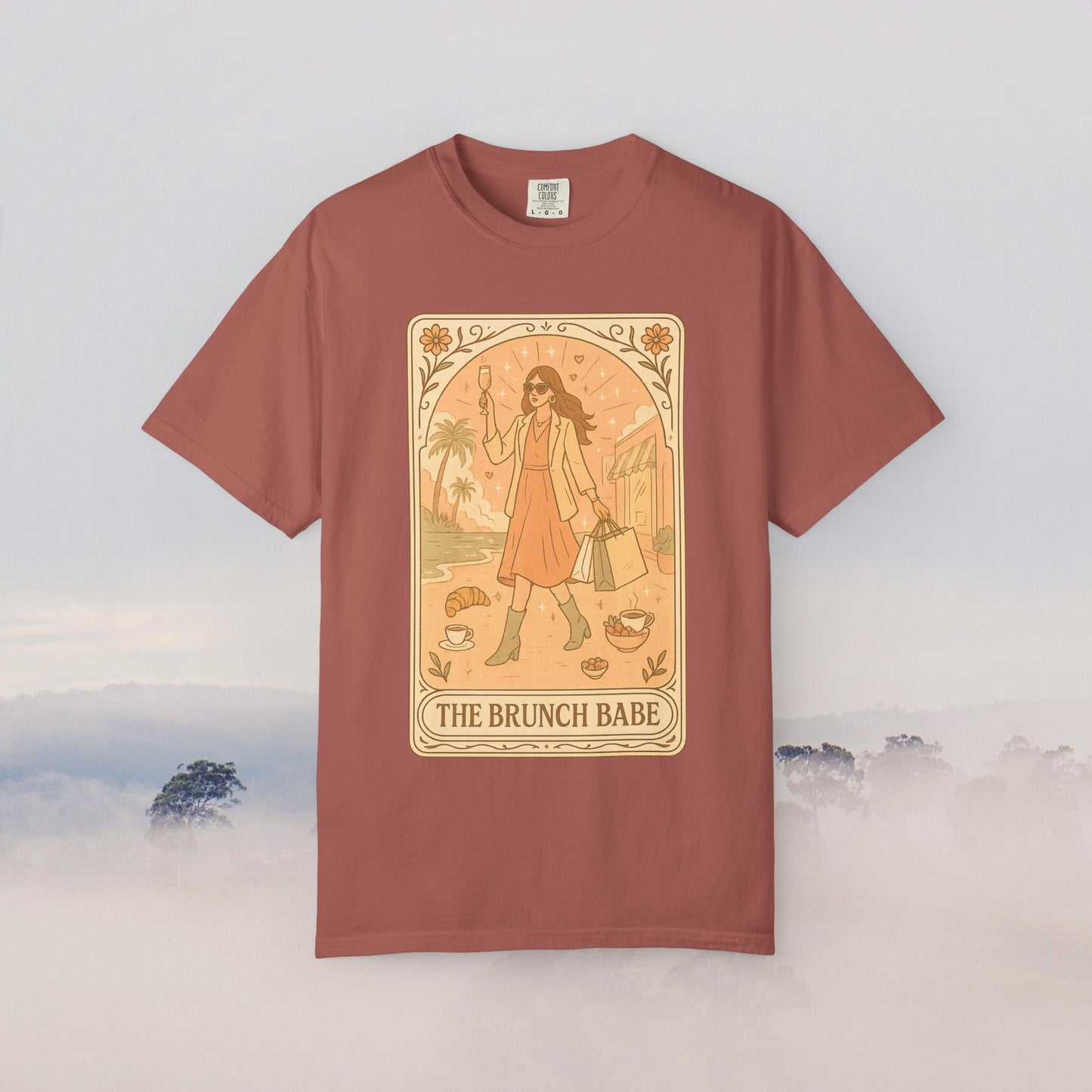 Brunch Babe Tarot Graphic Tee in dusty rose color, showcasing a stylish design with a fashionable woman holding a drink, perfect for casual wear.