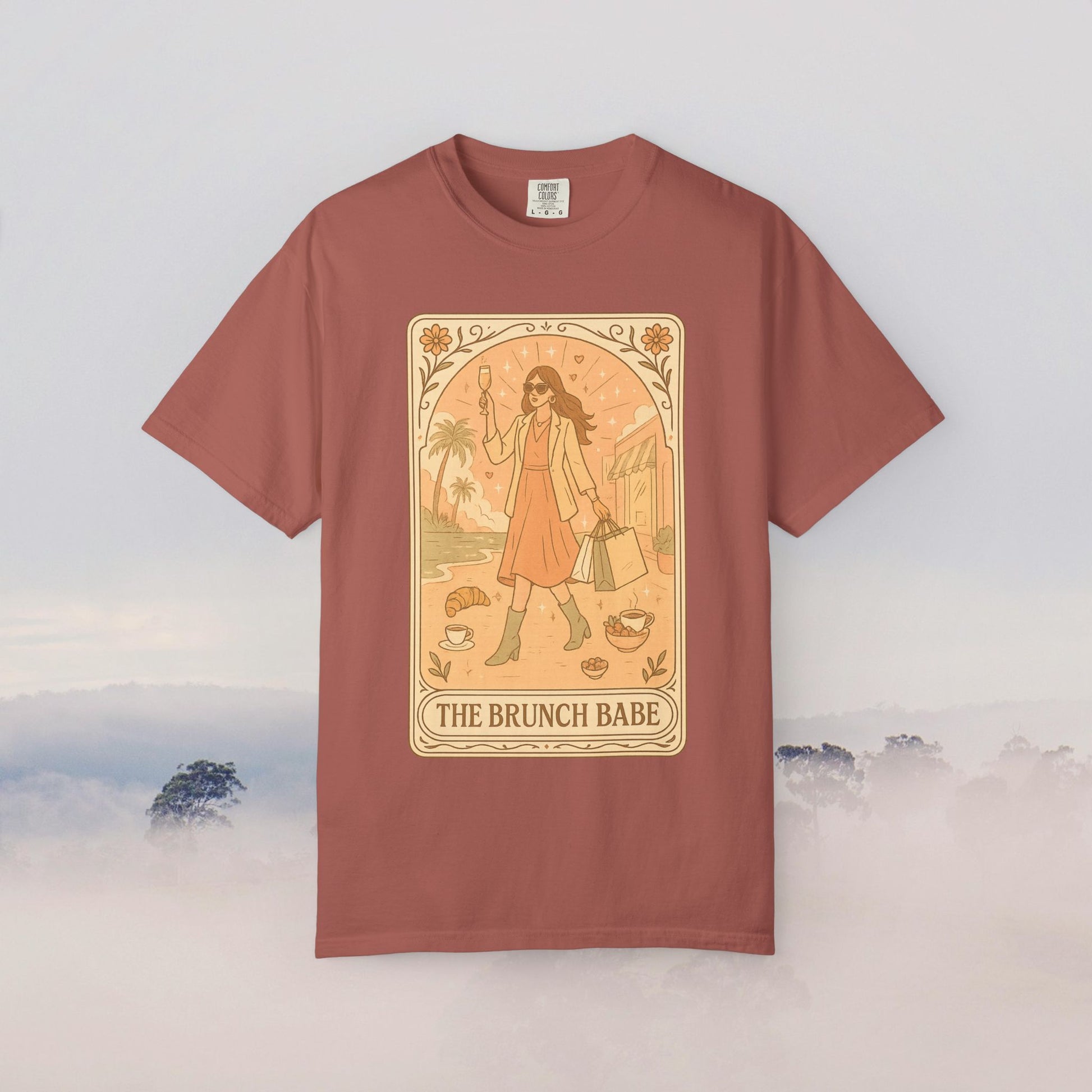 Brunch Babe Tarot Graphic Tee in dusty rose color, showcasing a stylish design with a fashionable woman holding a drink, perfect for casual wear.