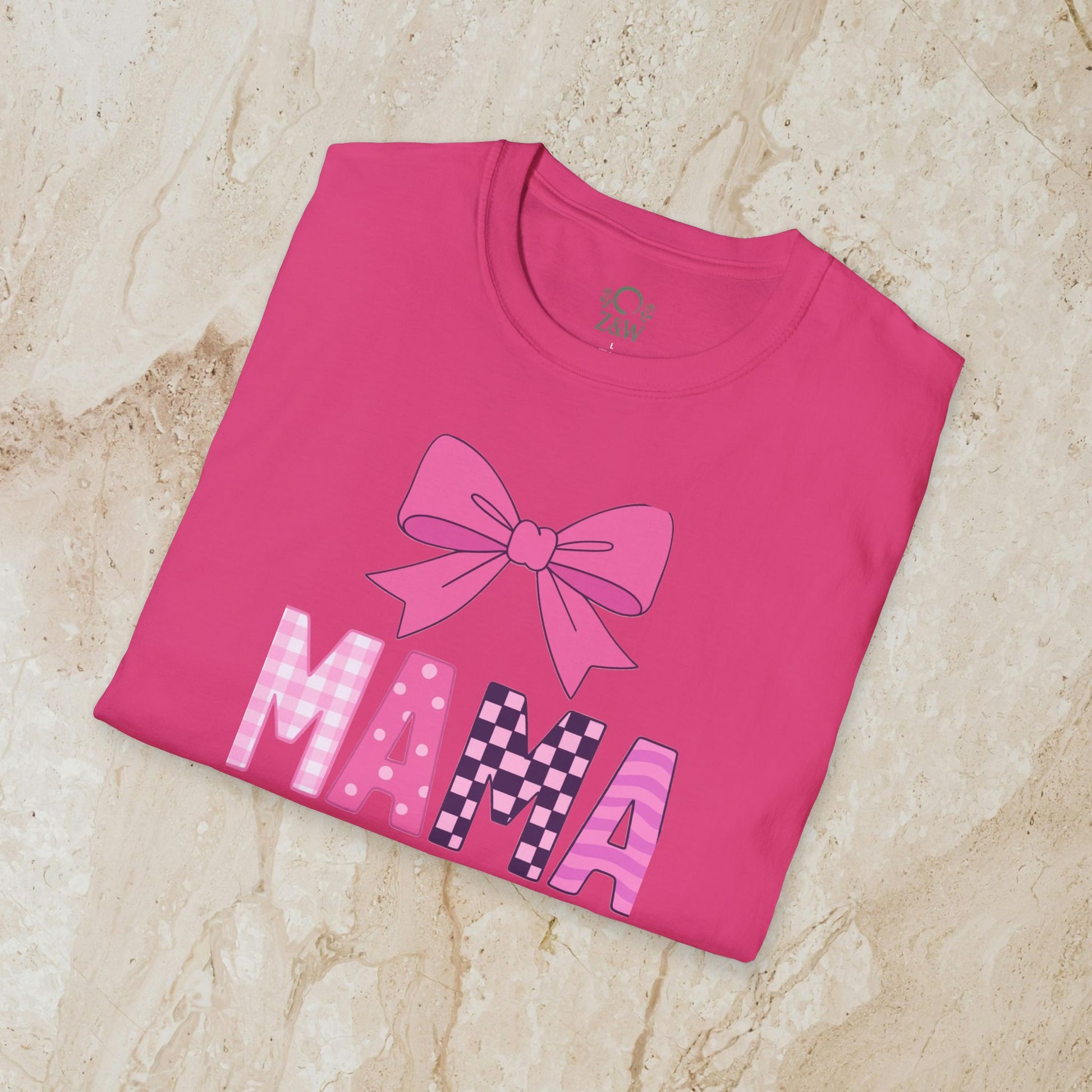 Mama Bow Tee displayed in a vibrant pink shade, showcasing a playful bow design and the word 'MAMA' in stylish typography, made from seamless 100% cotton.