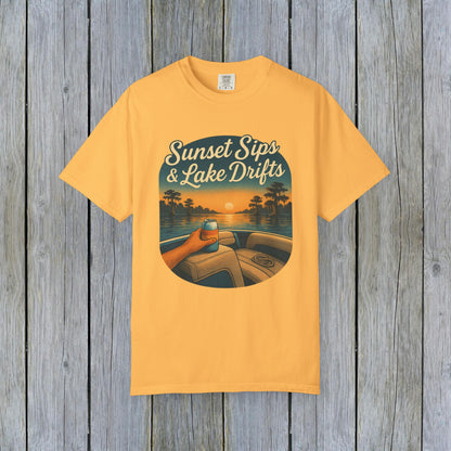 Lake Drifts T-Shirt in sunny yellow showcasing a vibrant sunset design with a drink in hand, ideal for summer outings.