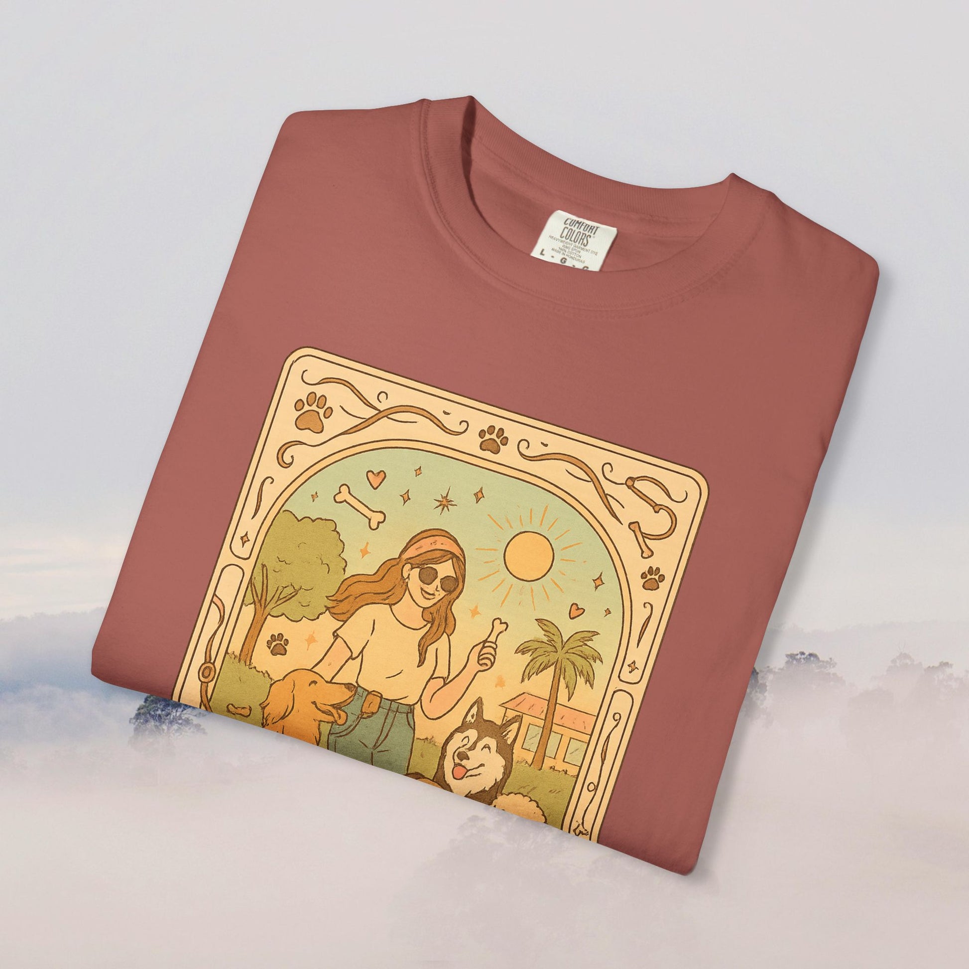 Animal Lover Tarot Tee in earthy red displaying a charming design of a pet lover with her dogs under the sun, made from comfortable 100% cotton, available from sizes S to 4XL.