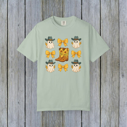 Cute Halloween T-Shirt featuring playful ghosts in cowboy hats and cowboy boots adorned with yellow bows, perfect for unisex fall fashion, made from eco-friendly fabric.