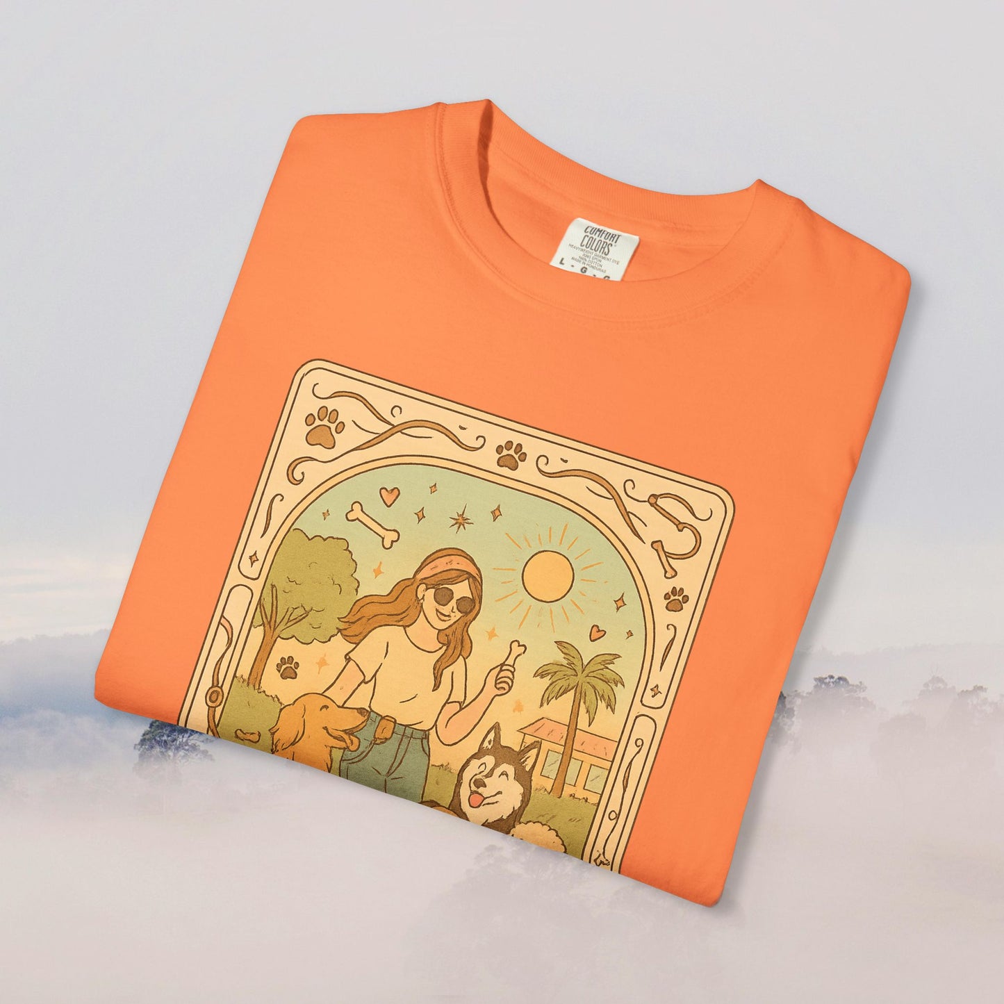Animal Lover Tarot Tee in vibrant orange, featuring a playful graphic of a person with dogs and a sun, made of soft 100% cotton and eco-friendly material.