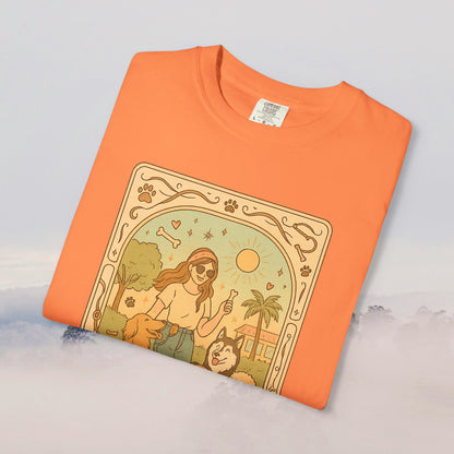 Animal Lover Tarot Tee in vibrant orange, featuring a playful graphic of a person with dogs and a sun, made of soft 100% cotton and eco-friendly material.