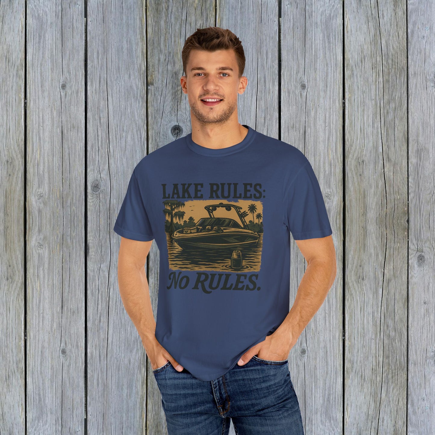 Another view of the model wearing the Unisex Garment-Dyed Lake Rules Tee, highlighting the relaxed fit and vintage style ideal for summer gatherings.