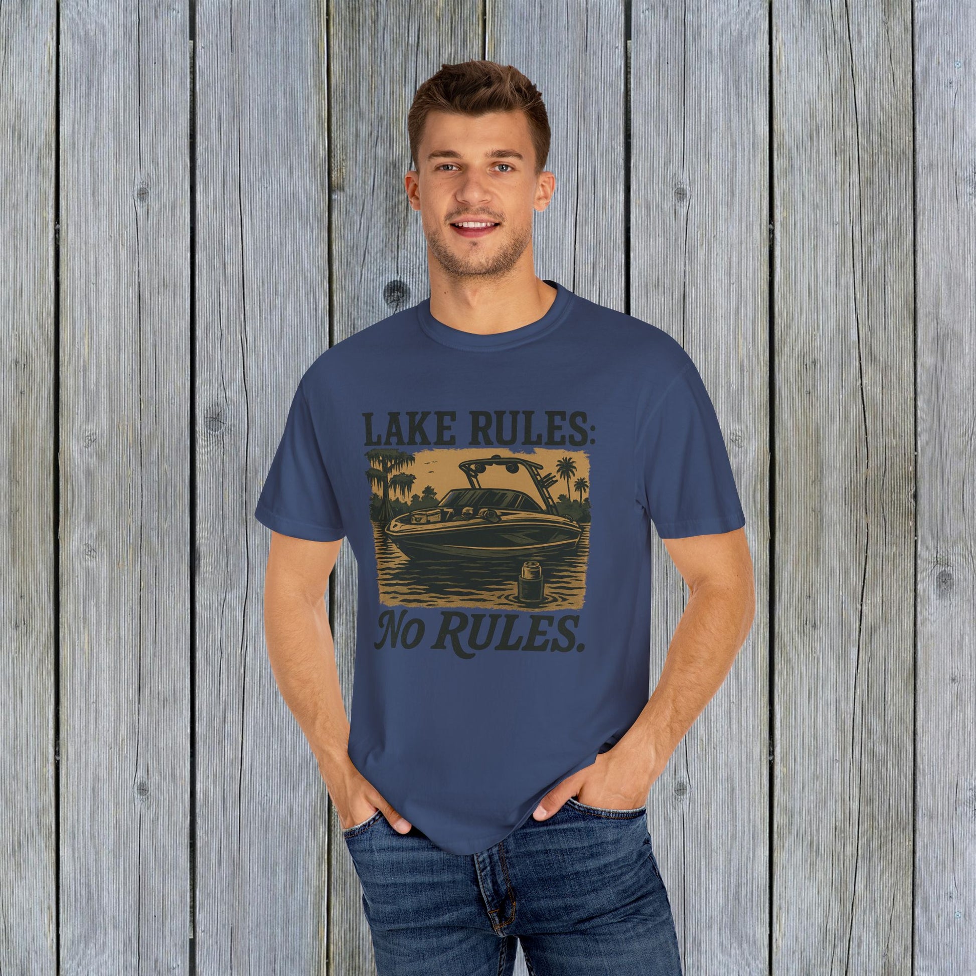 Another view of the model wearing the Unisex Garment-Dyed Lake Rules Tee, highlighting the relaxed fit and vintage style ideal for summer gatherings.