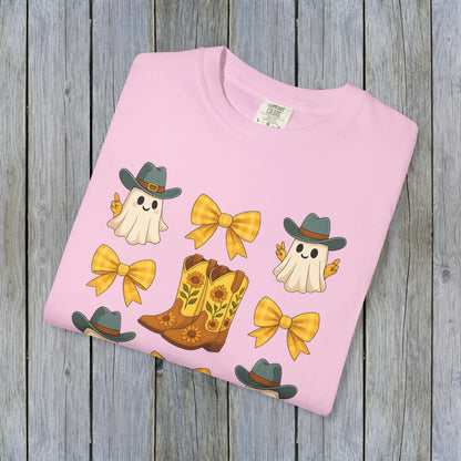 Cute Halloween T-Shirt featuring whimsical ghosts and cowboy boots, perfect for fall fashion, made from eco-friendly fabric.