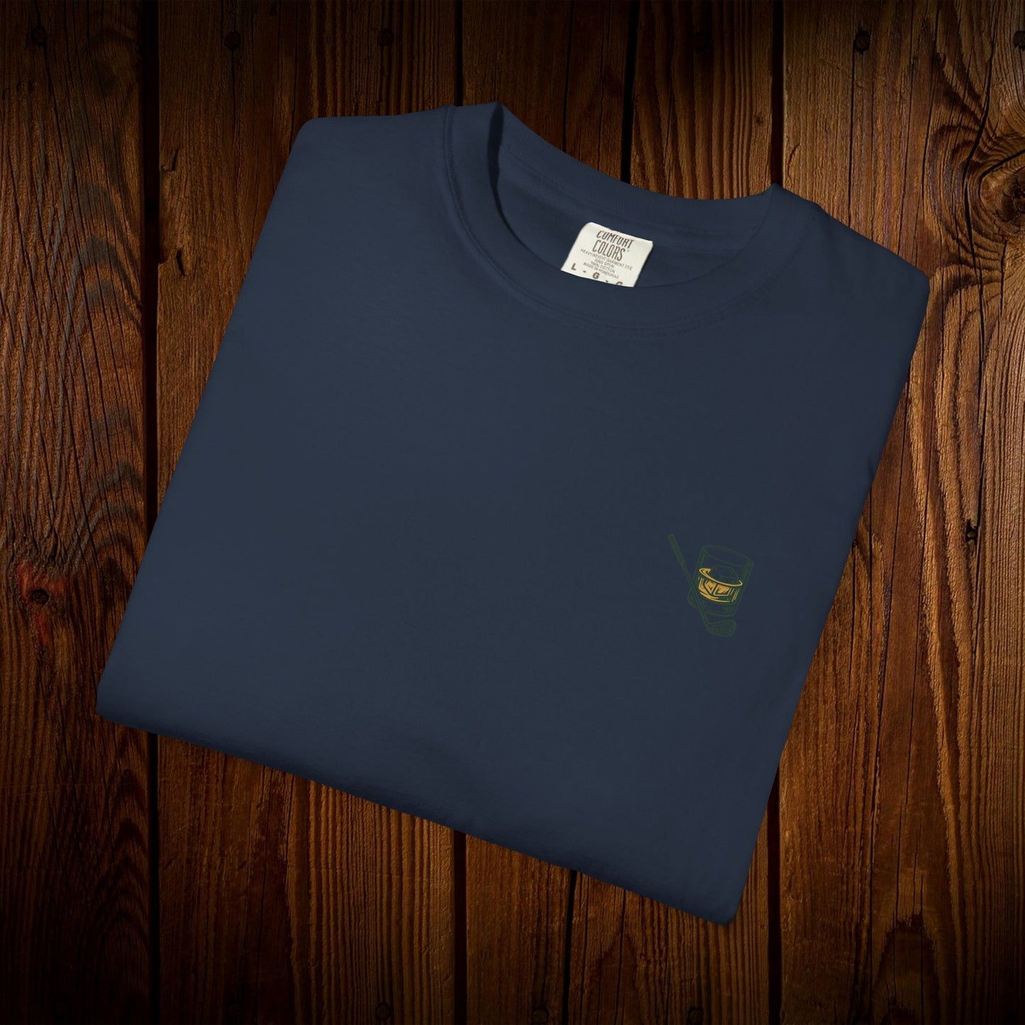 Men's Golf & Whiskey Tee in navy blue, featuring a unique whiskey glass print, made from soft, sustainable cotton.