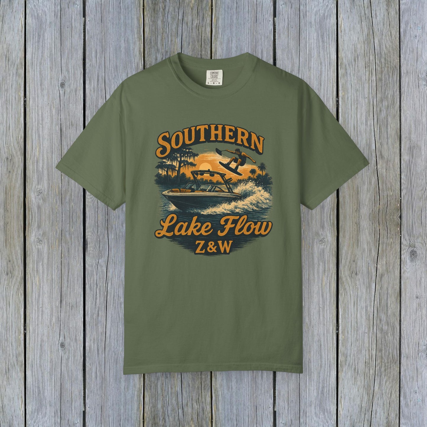 Southern Lake Flow T-Shirt in green, featuring a vibrant graphic of a person water skiing, made from eco-friendly 100% US cotton, available in sizes S-4XL.