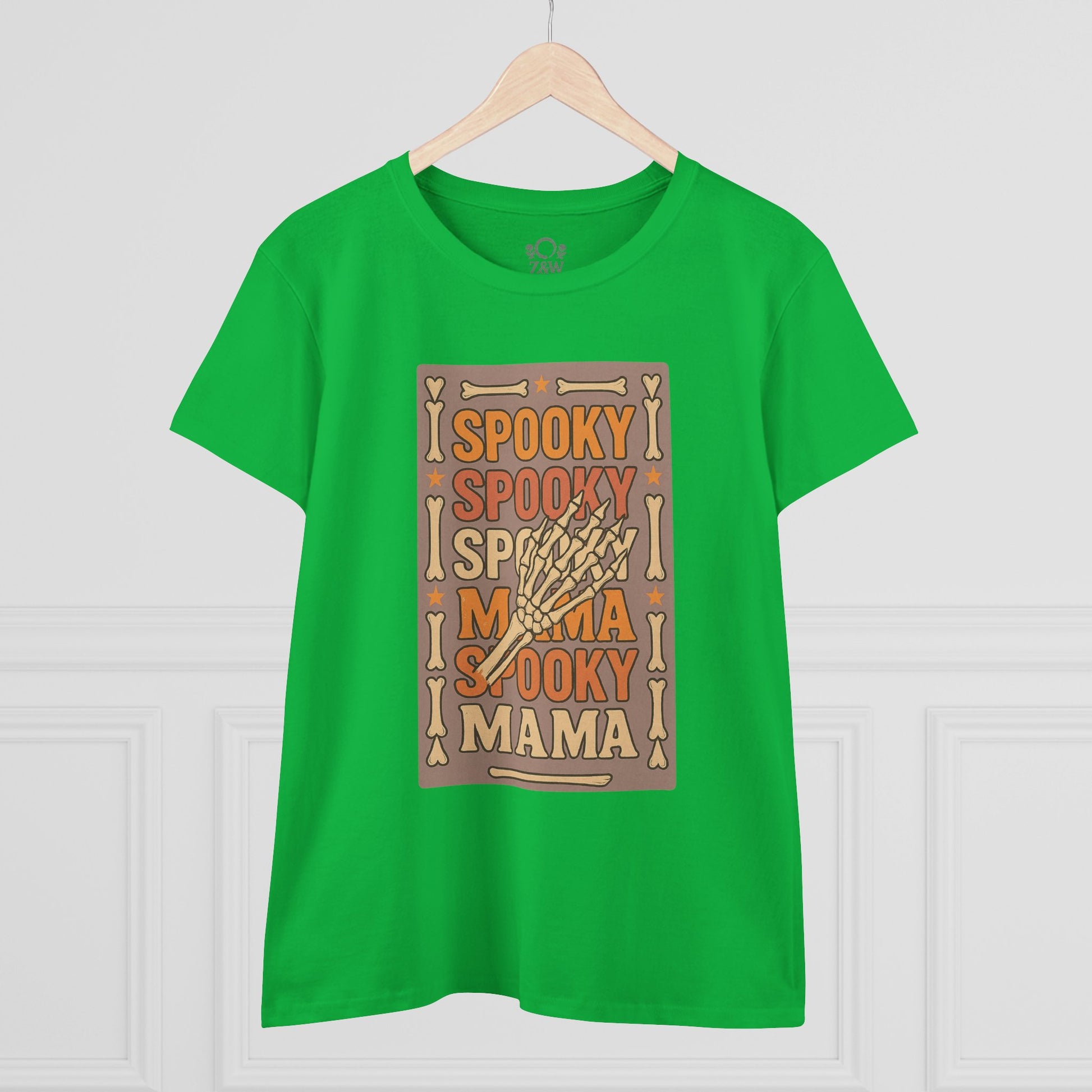 Front view of the Spooky Mama Tee in green displaying a playful skeleton hand design, perfect for adding a spooky touch to your wardrobe.