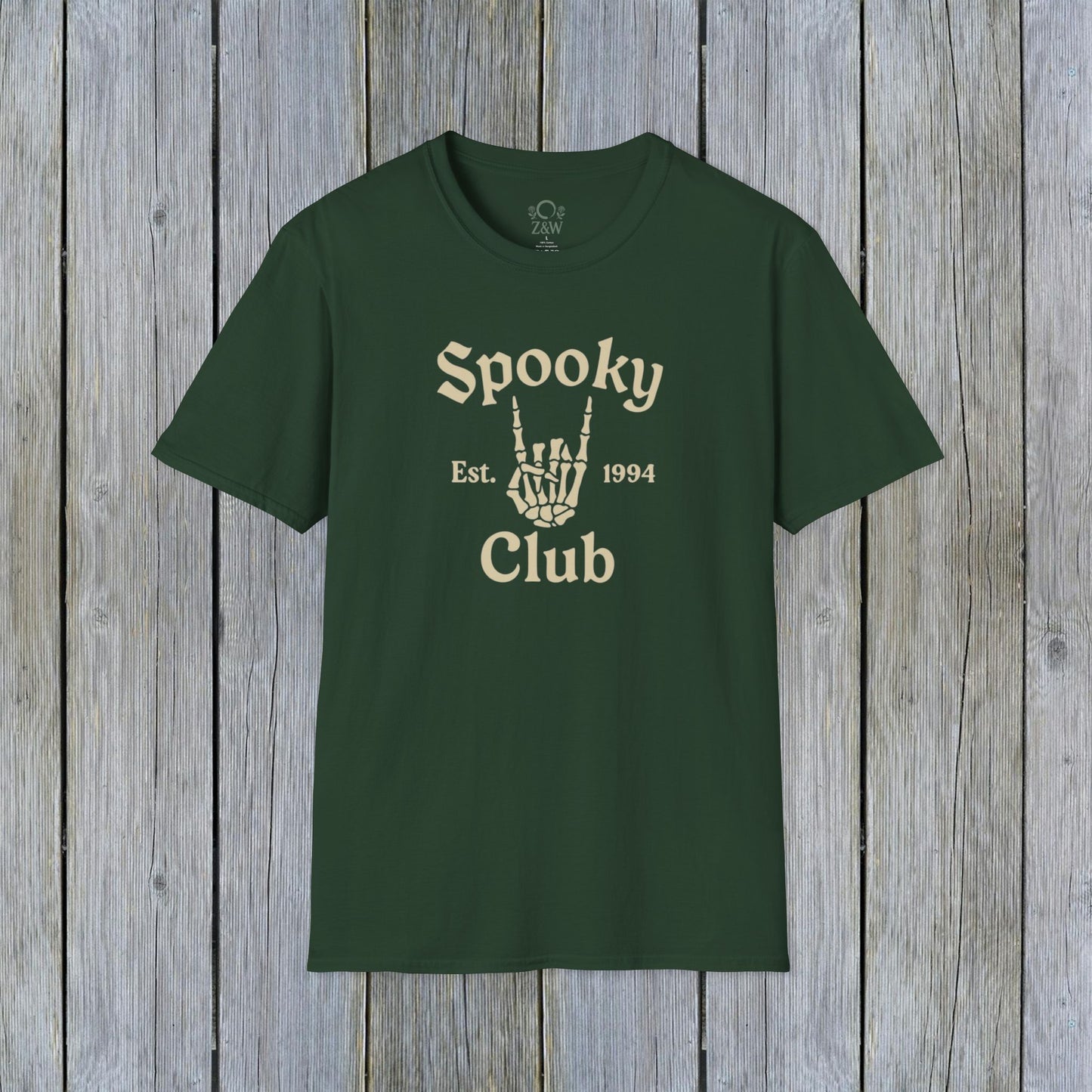 Unisex Spooky Club Tee in green, made of durable 100% cotton, showcasing a unique skeleton hand design and 'Spooky Club Est. 1994' lettering, ideal for festive occasions.