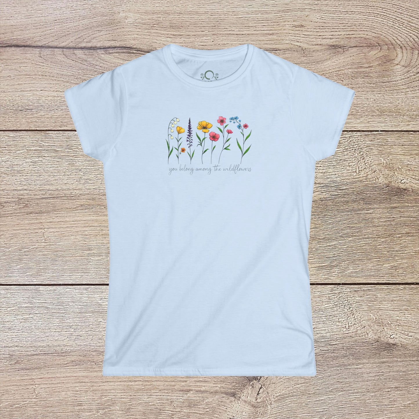 Wildflowers T-Shirt in white featuring a floral design and the quote 'you belong among the wildflowers'. Perfect for a comfortable and stylish look.
