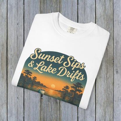 Folded Lake Drifts T-Shirt in white featuring a colorful sunset and lake scene graphic, ideal for a relaxed summer look.