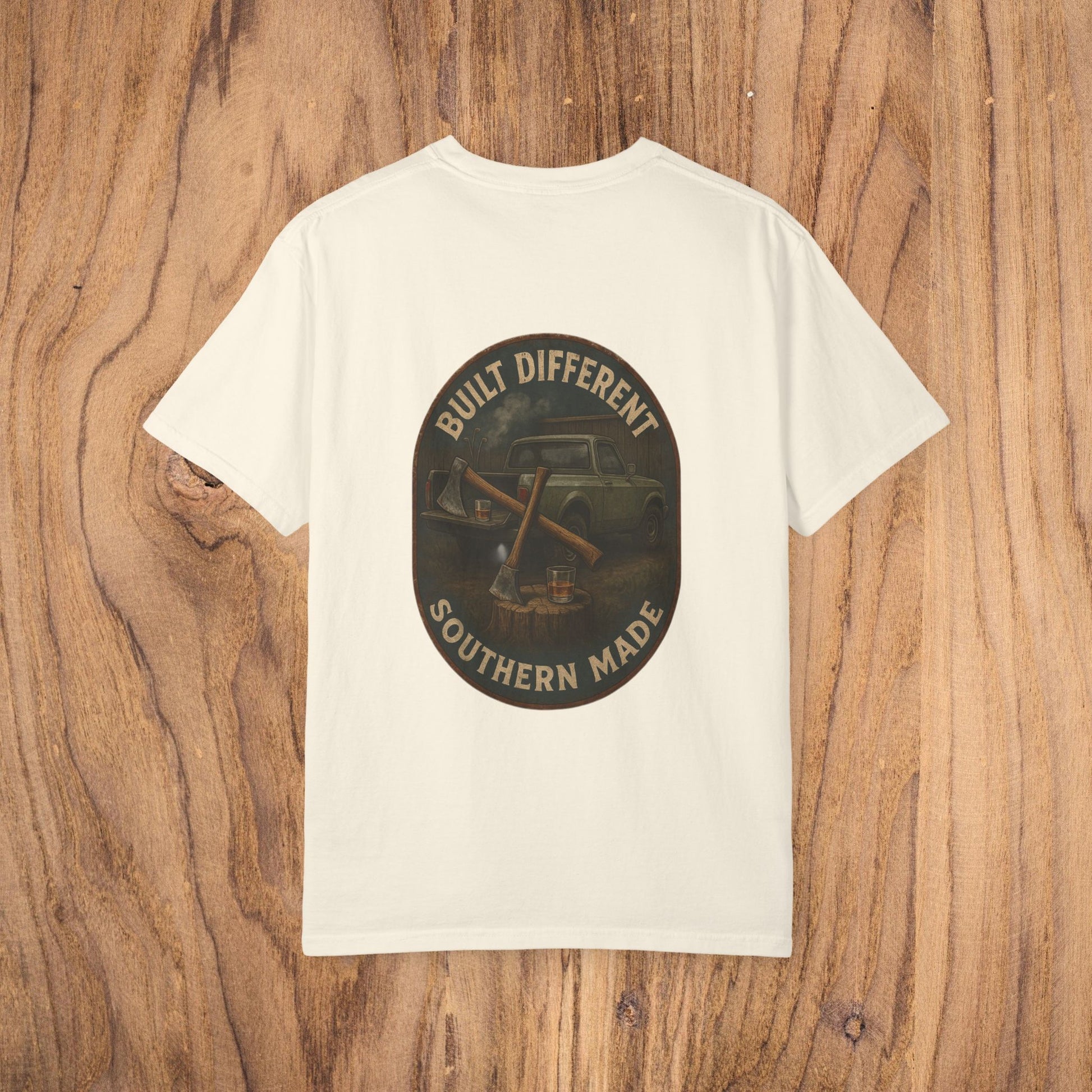 The back view of a Premium Southern Made T-Shirt in cream color, featuring 'BUILT DIFFERENT SOUTHERN MADE' on the shirt.