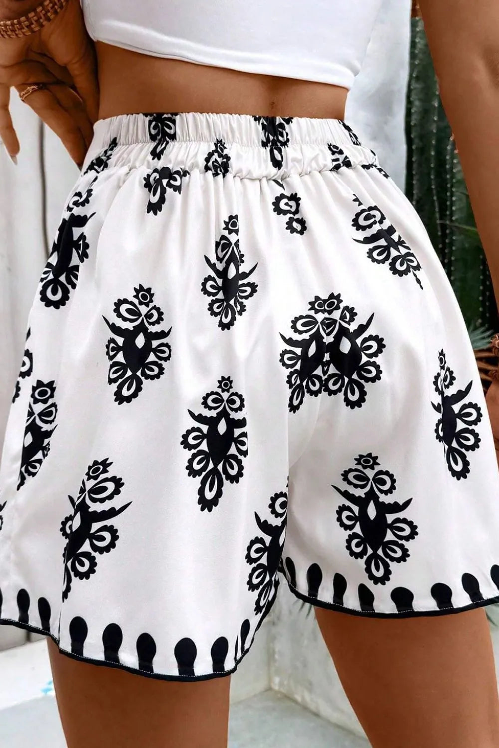 Tied Printed Shorts featuring a stylish black and white pattern, perfect for casual summer outings.