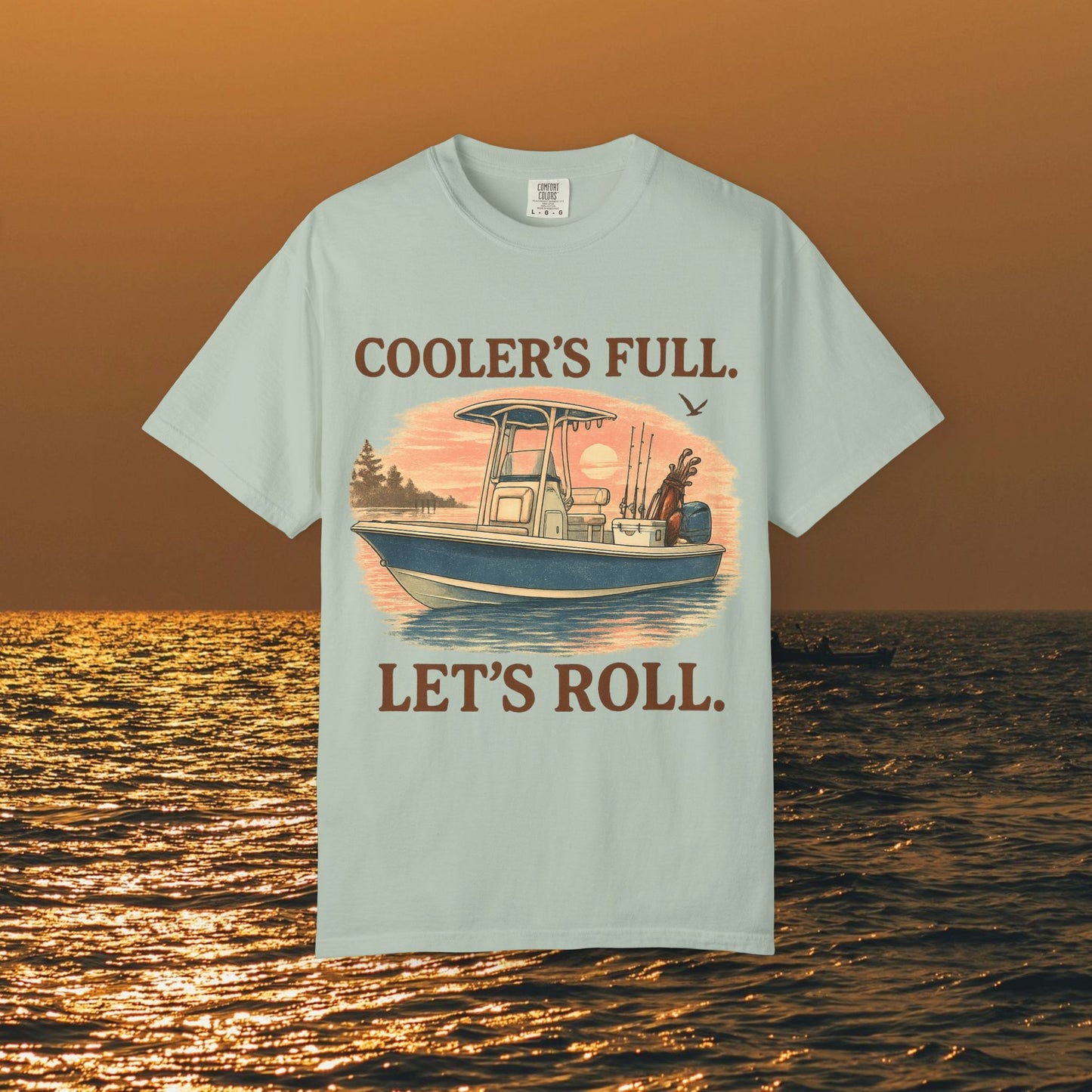 Men's & Women's Durable Cotton Full Tee showcasing a light blue fabric with an illustrated boat scene and the text 'COOLER'S FULL. LET'S ROLL.' Ideal for outdoor adventures.