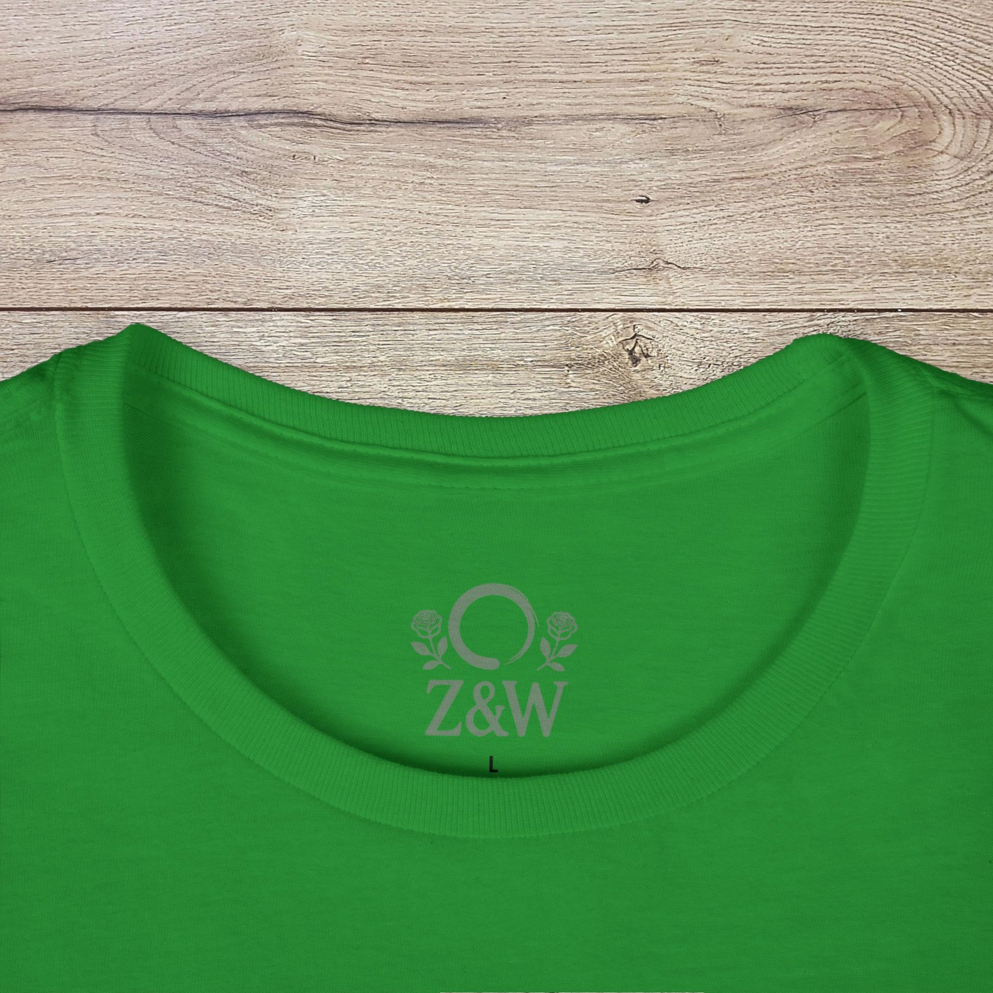 Close-up of the neckline on a bright green Fall Pumpkin Campfire T-Shirt, showcasing the Z&W logo, ideal for cozy Halloween gatherings.