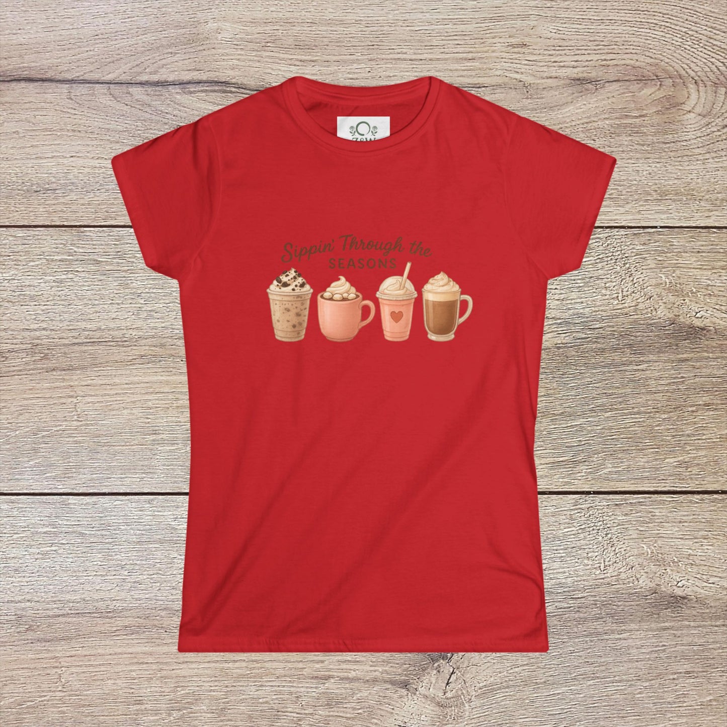 Sippin' Through The Seasons Slim Fit Tee in red displaying a vibrant illustration of four stylish coffee mugs, perfect for anyone who enjoys seasonal beverages.