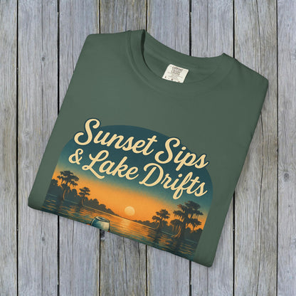 Flat lay of Lake Drifts T-Shirt in army green color, highlighting its stylish sunset and lake illustration, ideal for outdoor wear.