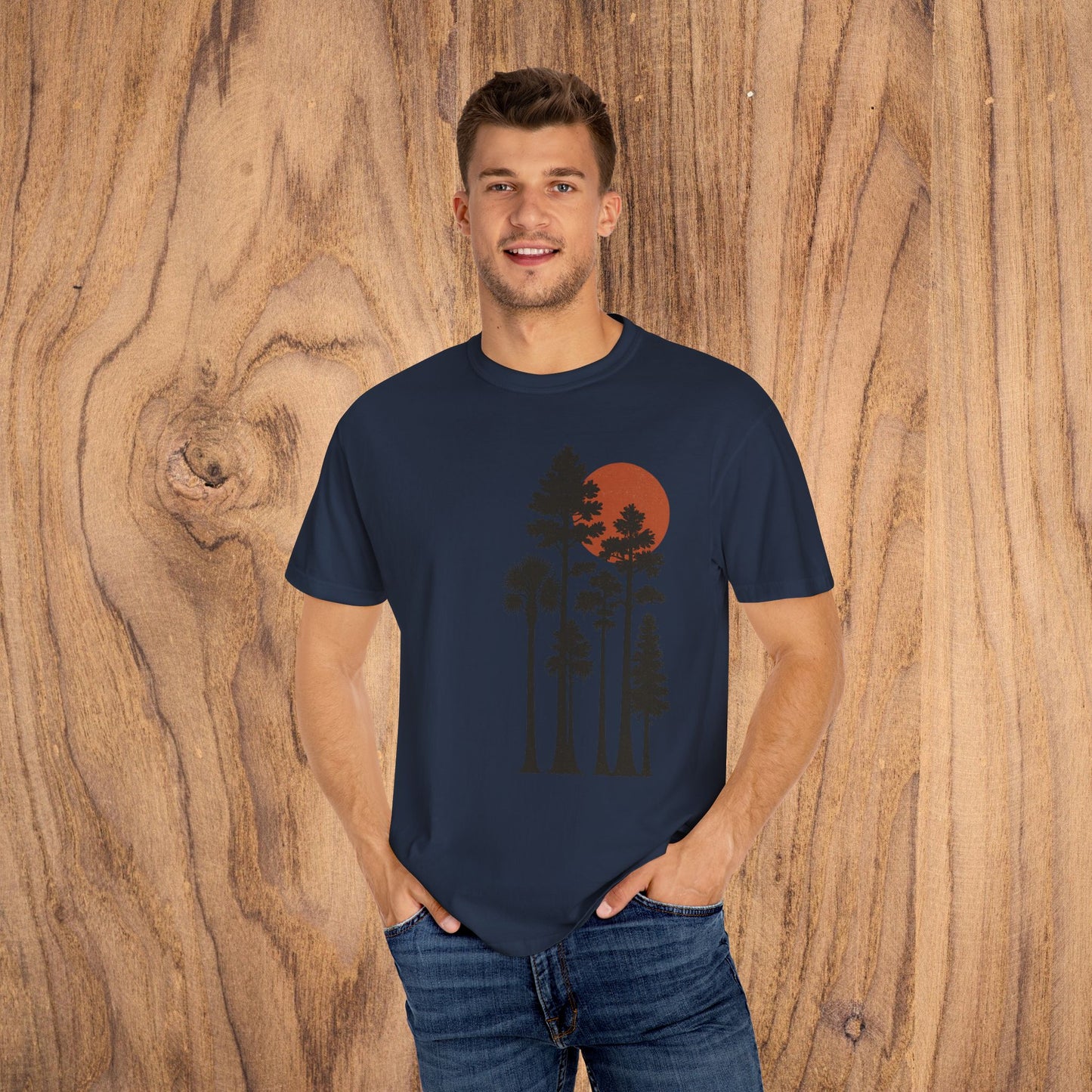 Model wearing Sunset Trees Unisex T-Shirt with sunset design, highlighting the relaxed fit and style ideal for nature lovers.