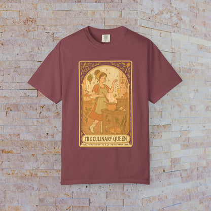 Culinary Queen Tarot Tee in maroon, featuring an enchanting illustration of a queen cooking with a goose, available in sizes S to 4XL, made from soft, pre-shrunk cotton.
