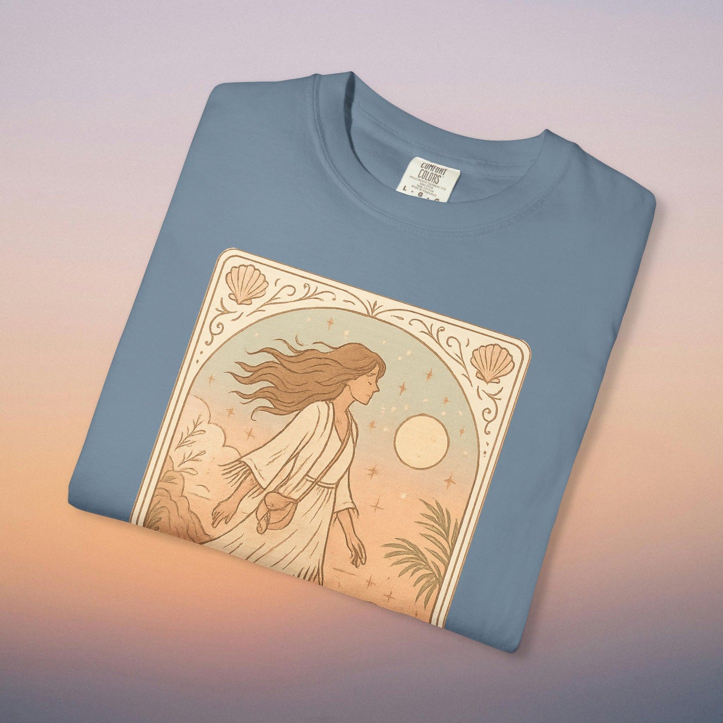 Wanderer Tarot Graphic Tee in blue color, featuring an enchanting design of a woman among nature, made from 100% ethically made cotton, available in a range of sizes from S to 4XL.
