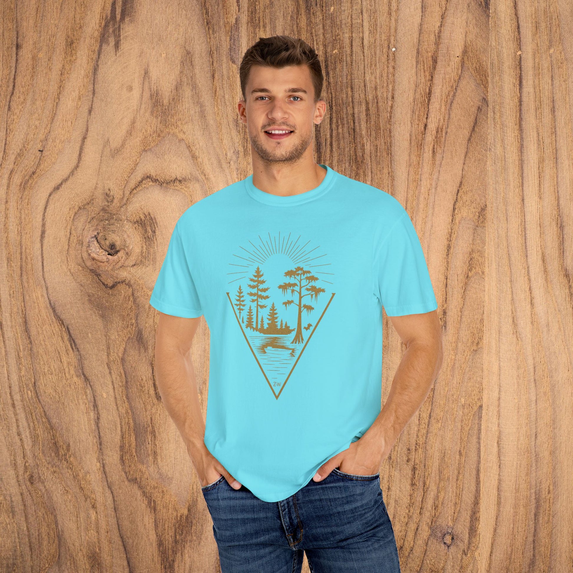 Nature Outdoor Vibes Tee in bright blue, highlighted by a beautiful nature graphic with trees and sun rays, crafted from soft 100% US cotton. Sizes range from S-4XL.
