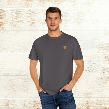 Men's Rodeo On The Rocks Tee in dark gray, model smiling while wearing a comfortable 100% US cotton shirt.